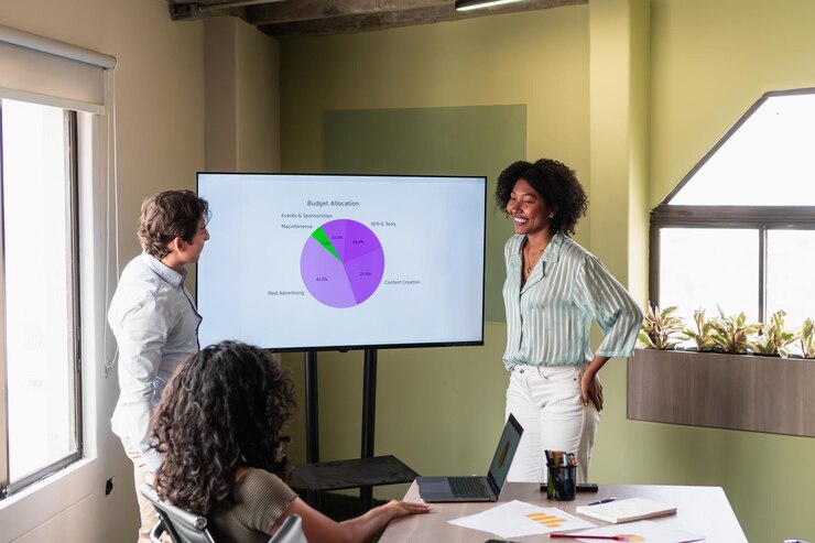 Photo marketing professionals discussing budget allocation in a meeting