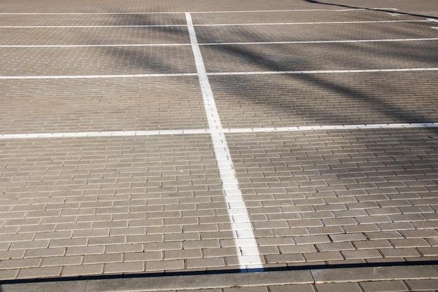 Markings in an empty parking lot for cars