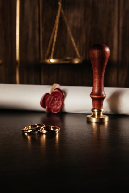 Marriage contract with seal and golden rings vertical\
image