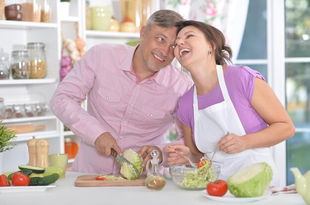 Married couple cooking together