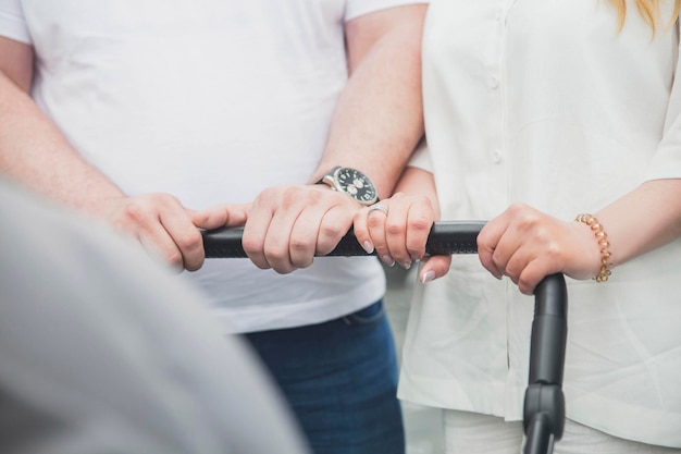 married couple is driving a baby stroller