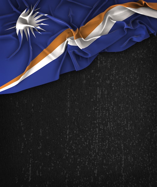 Photo marshall islands flag vintage on a grunge black chalkboard with space for text