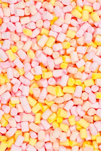 Marshmallow Achtergrond van roze en gele kleurrijke mini marshmallows