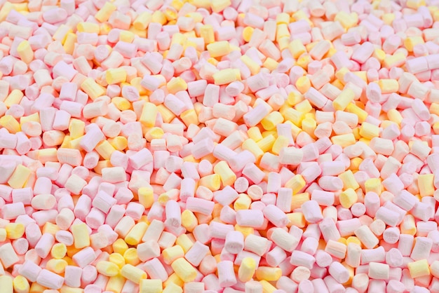 Marshmallow. Background of pink and yellow colorful mini marshmallows.