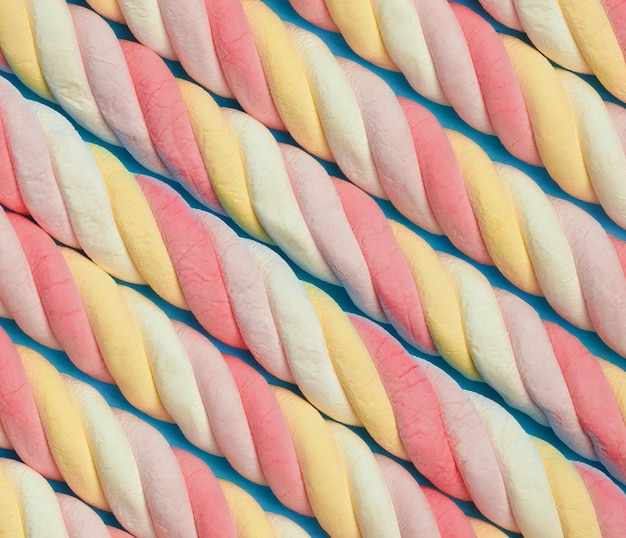 Marshmallow background Sweet candy colorful diagonal texture Rainbow colored marshmallow twists