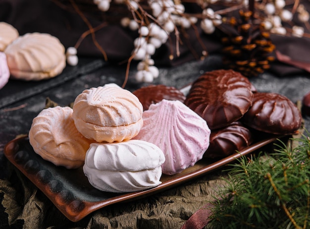 Marshmallow cakes in chocolate glaze and christmas decor