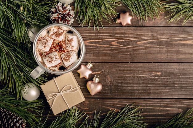 Marshmallow coffee and gift on the wooden table