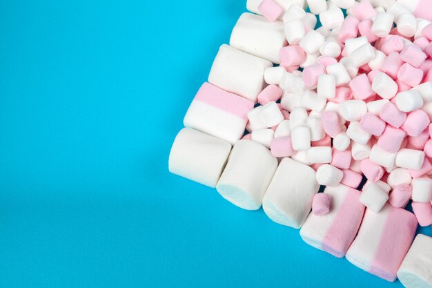 Marshmallow laid out on blue paper