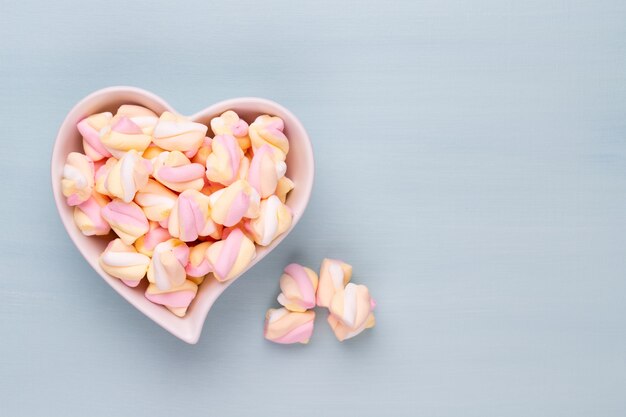 Marshmallows on blue table