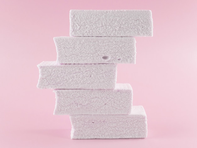 Photo marshmallows on a pink background