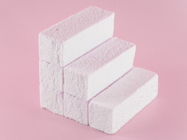 Marshmallows on a pink background