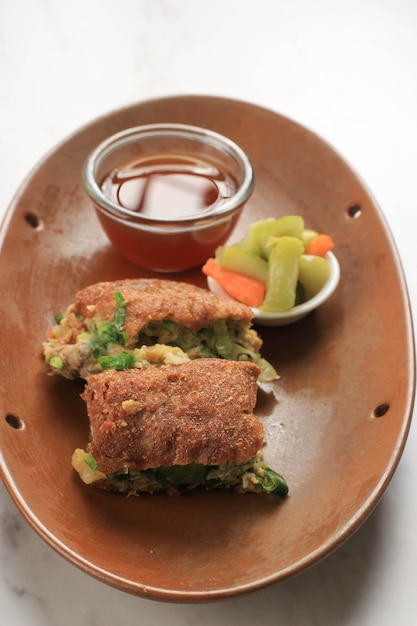 Martabak Telur is Popular Street Food in Indonesia. Egg, Spring Onion Wrapped with Thin Flour Batter