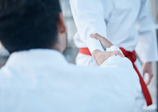 Martial arts men handshake and fight for sport training or exercise with teacher master and guide Fitness partnership mentor or coach with shaking hands for karate in contest competition or gym