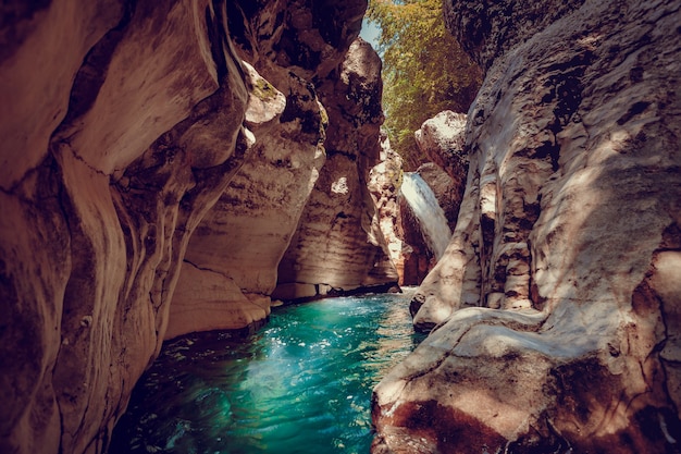 Martvili canyon in Georgia. Beautiful canyon with blue water mountain river. Place to visit. Nature landscape. Travel background. Holiday, rafting, sport, recreation. Vintage retro toning filter