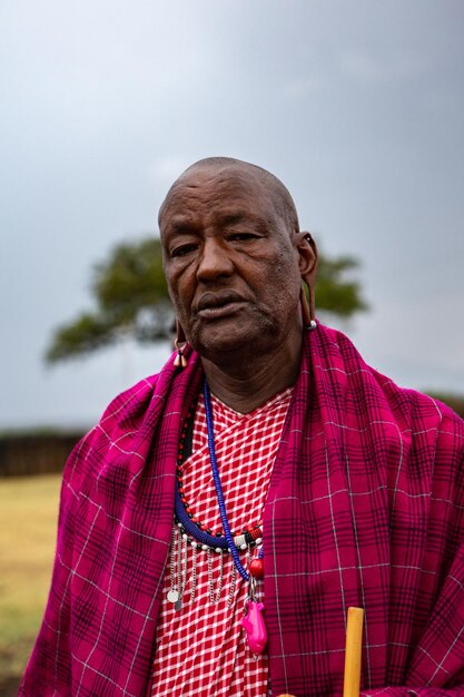 Masai in traditional colorful clothing showing maasai jumping dance at local tribe village