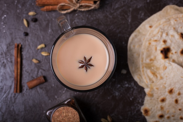 Masala chai tea and roti or bhatoora  . Hot indian beverage with spices