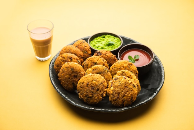 Masala Chana Dal Vada or Parippu or Paruppu Vadai is a Tea Time fried snacks recipe from Maharashtrian and Kerala. served in a plate