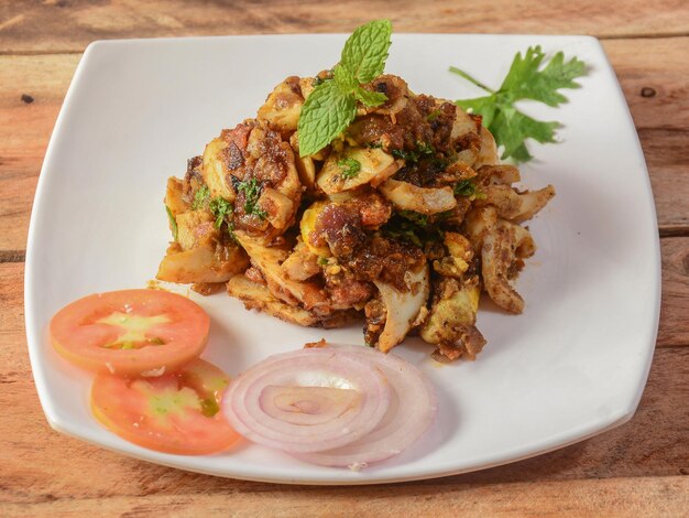 Masala egg fry special street food made of boiled egg fried\
with onion pepper and tomato selective focus