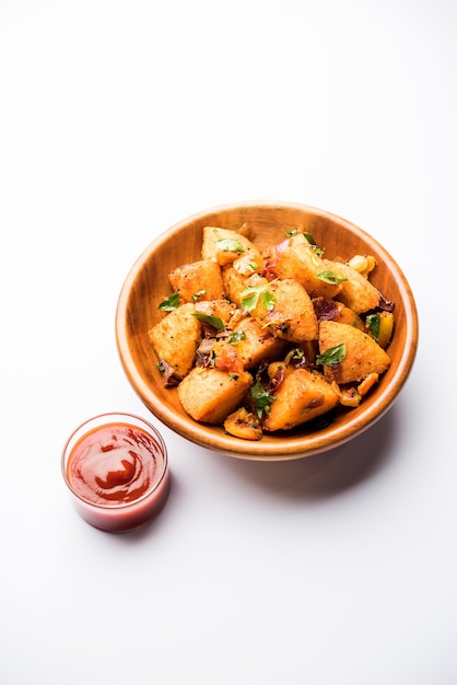 Masala fried Idlies - south indian Snack made using with leftover idly served with tomato ketchup. selective focus