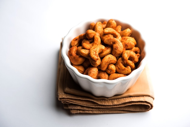 Masala Kaju or spicy Cashew in a bowl. Popular festival snack from India, asia, also known as Chakna recipe