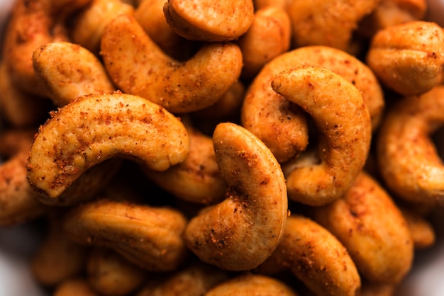 Masala Kaju or spicy Cashew in a bowl. Popular festival snack from India, asia, also known as Chakna recipe