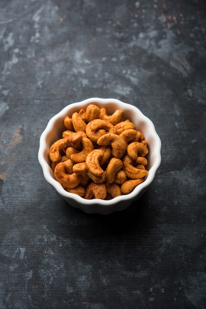 Masala Kaju or spicy Cashew in a bowl. Popular festival snack from India, asia, also known as Chakna recipe