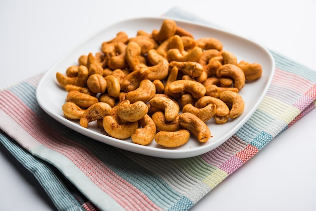 Masala Kaju or spicy Cashew in a bowl. Popular festival snack from India, asia, also known as Chakna recipe