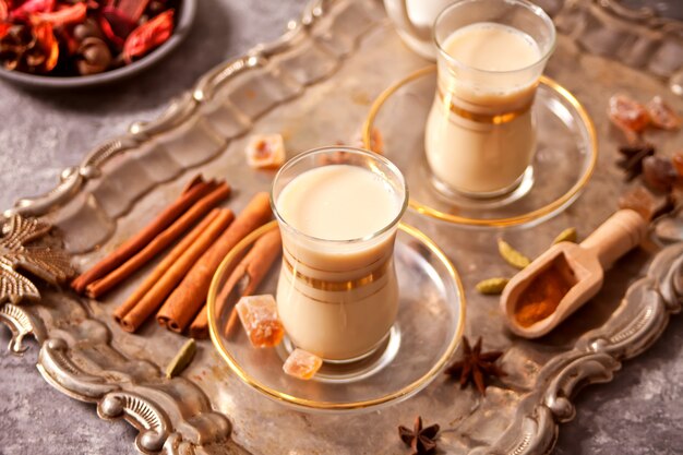 Masala tea chai with milk and spices.