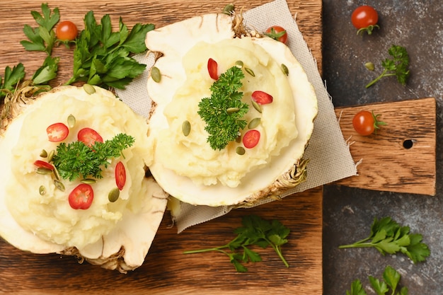 Mashed celery root on wooden cutting board