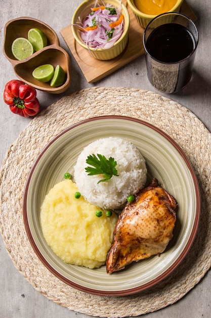 Mashed potatoes and baked chicken with rice Traditional peruvian comfort food homemade cuisine