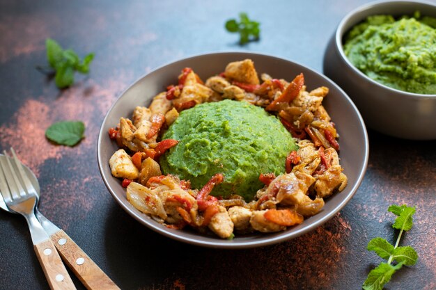 Mashed potatoes with green peas and corn