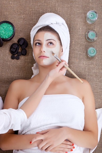 Mask face for woman in spa salon