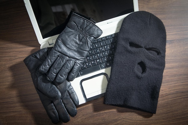 Mask gloves and laptop computer on the table