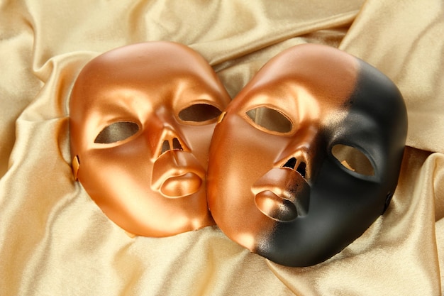 Photo mask on gold fabric background