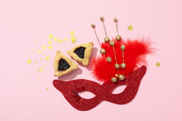 A mask with traditional cookies for the day of Purim