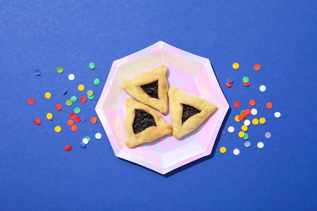 A mask with traditional cookies for the day of Purim