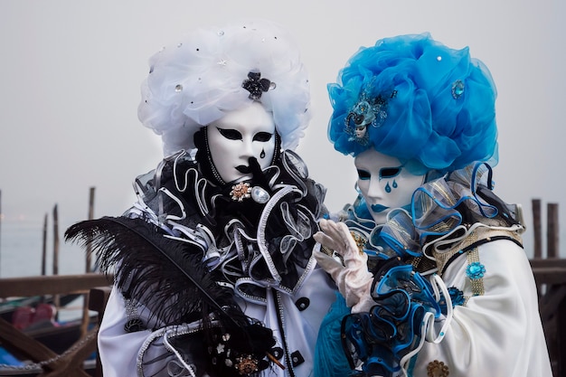 Masked Couple wearing carnival costumes