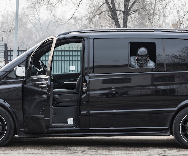 masked criminal men in car