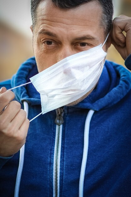 Masked man from coronavirus and air. Protection against PM 2.5 air polluted from thea  virus in Europe and Asia