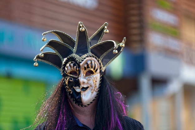 masked party goer during the carnival of grand boucan