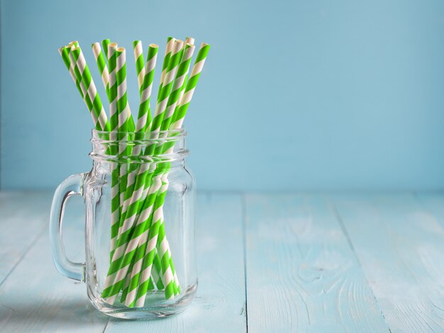 Mason jars with yellow paper straws and cap. Ideal for summer drinks and smoothies.