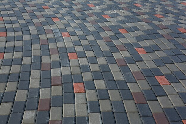 Masonry stone paving on a pedestrian walkway or sidewalk