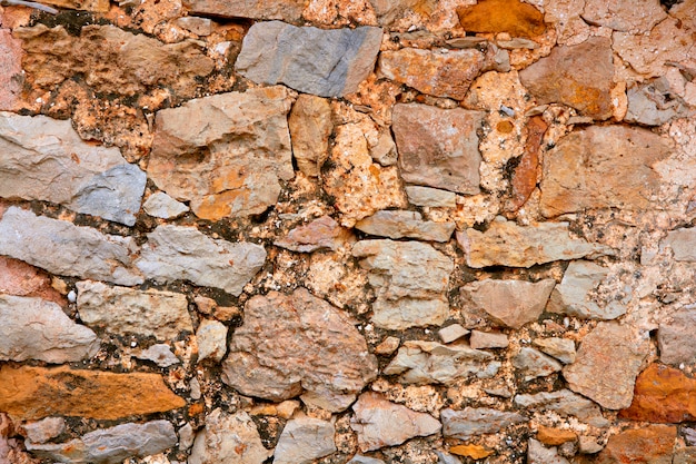 Photo masonry stone wall texture, old spain ancient architecture detail