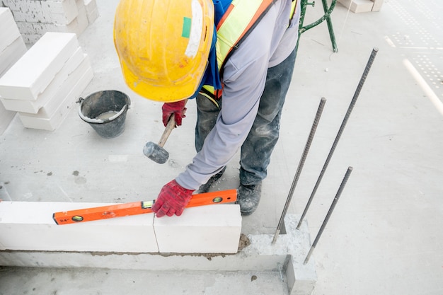 Masonry work at home building construction site