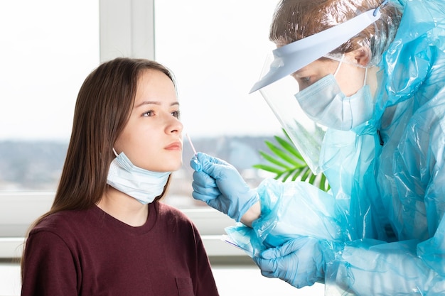 Mass testing for coronavirus Swab test covid19 a doctor in a protective suit takes analysis