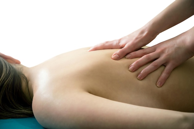 Massage of the back on a white background