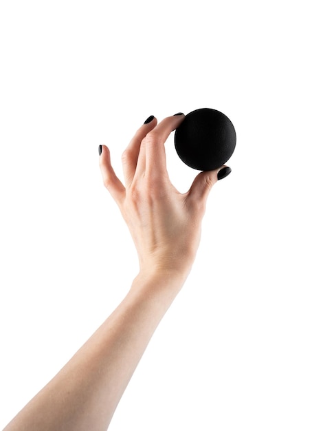 Massage black ball in female hand for trigger points isolated on a white background Concept of myofascial release