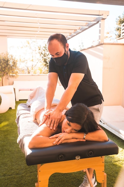 Massage at the client's home on the terrace photo at sunset