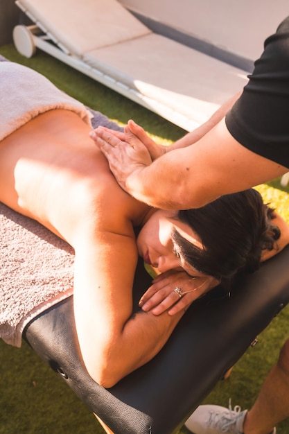 Massage at the client's home on the terrace photo at sunset