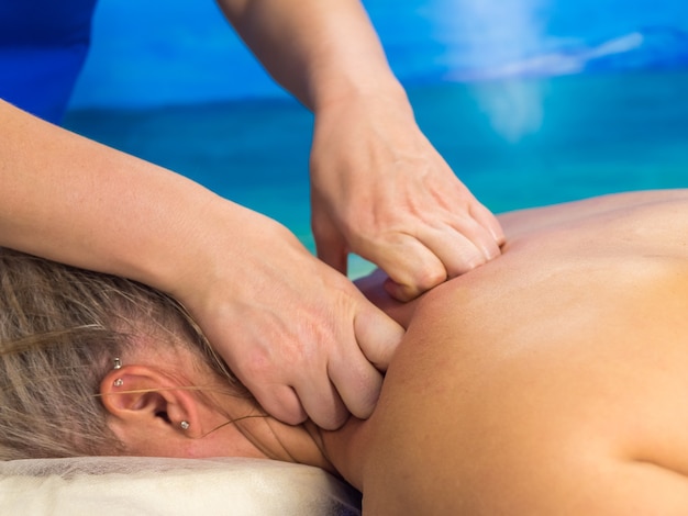 Massage in clinic Woman getting recovery closeup